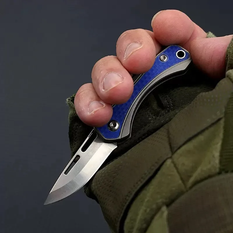Nuovo mini coltello pieghevole portatile D2 Lama in lega di titanio Maniglia Tasca Sopravvivenza Tattica di caccia Utilità Coltelli da frutta Strumento EDC
