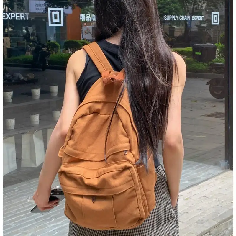 

Large capacity solid color all-match schoolbag female student backpack washed canvas bag shoulders school backpack for students