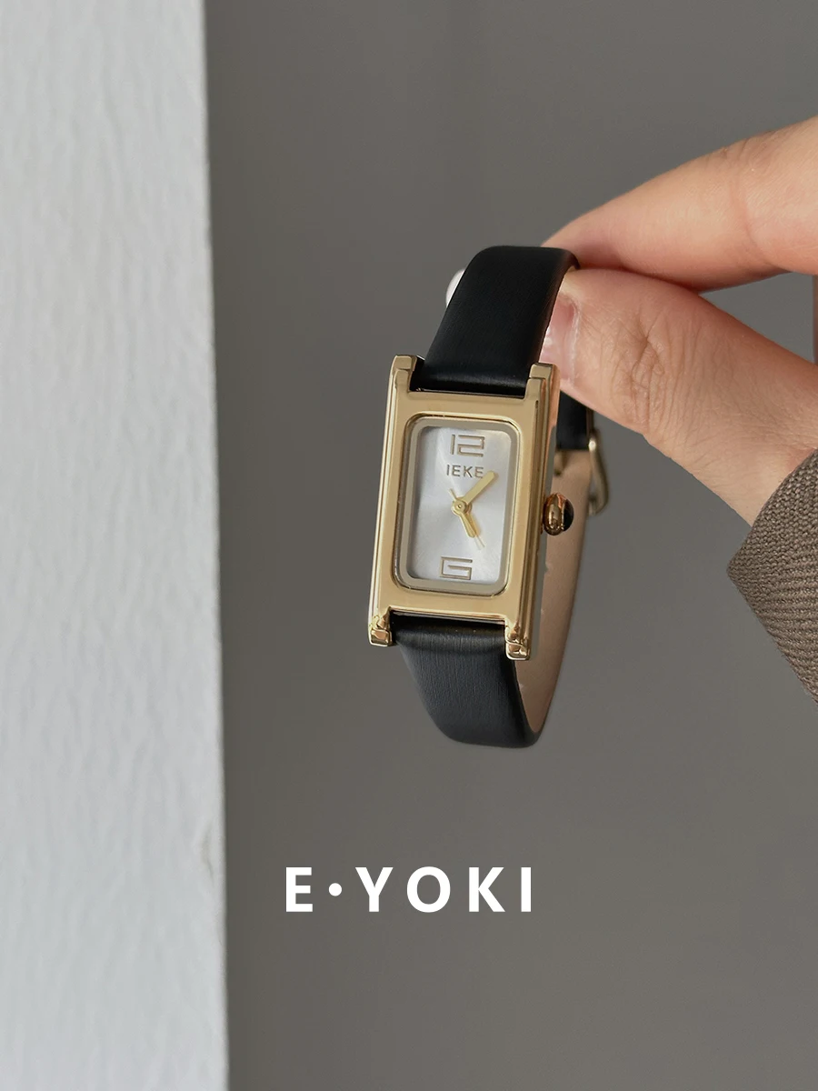 Neue schwarze und goldene Quarzuhr im koreanischen Stil, luxuriöse Damenuhr mit hochwertigem Gefühl, schlichtem Lederarmband, Vintage-Stil.