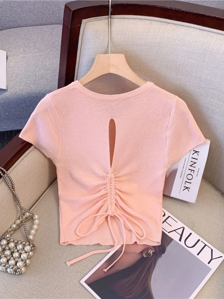 

Sweet And Spicy Girl Pink Short Sleeve Knitted Top Women's 2026 Summer Backless Hollow out Belt Design Unique Small Audience