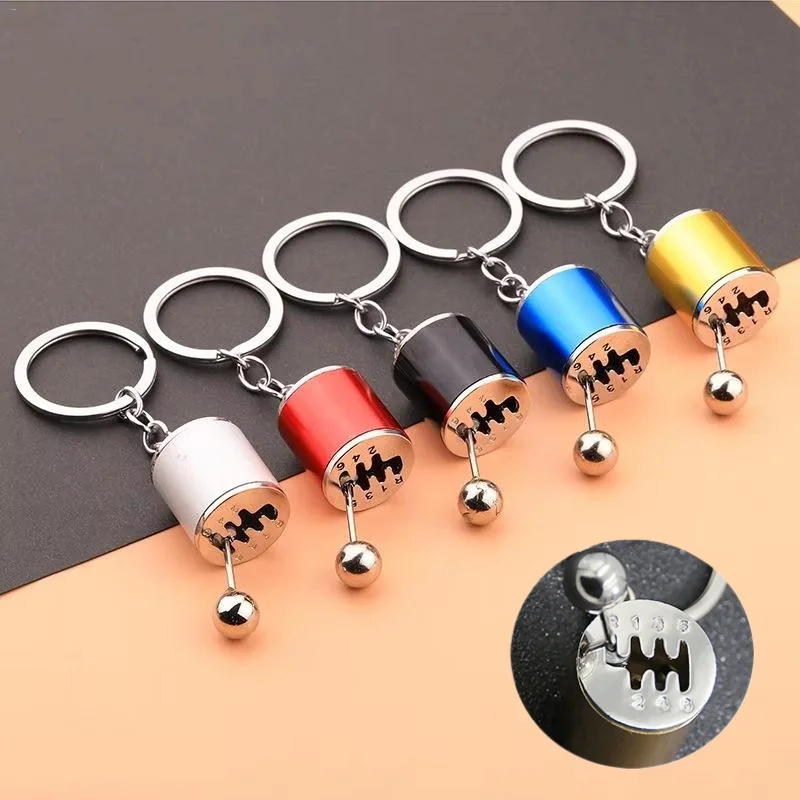 Symulacja samochodu, manualna zmiana biegów, modyfikacja, zawieszka antystresowa, sześciobiegowa skrzynia biegów, brelok do kluczy, metalowa zawieszka do samochodów, zabawka.