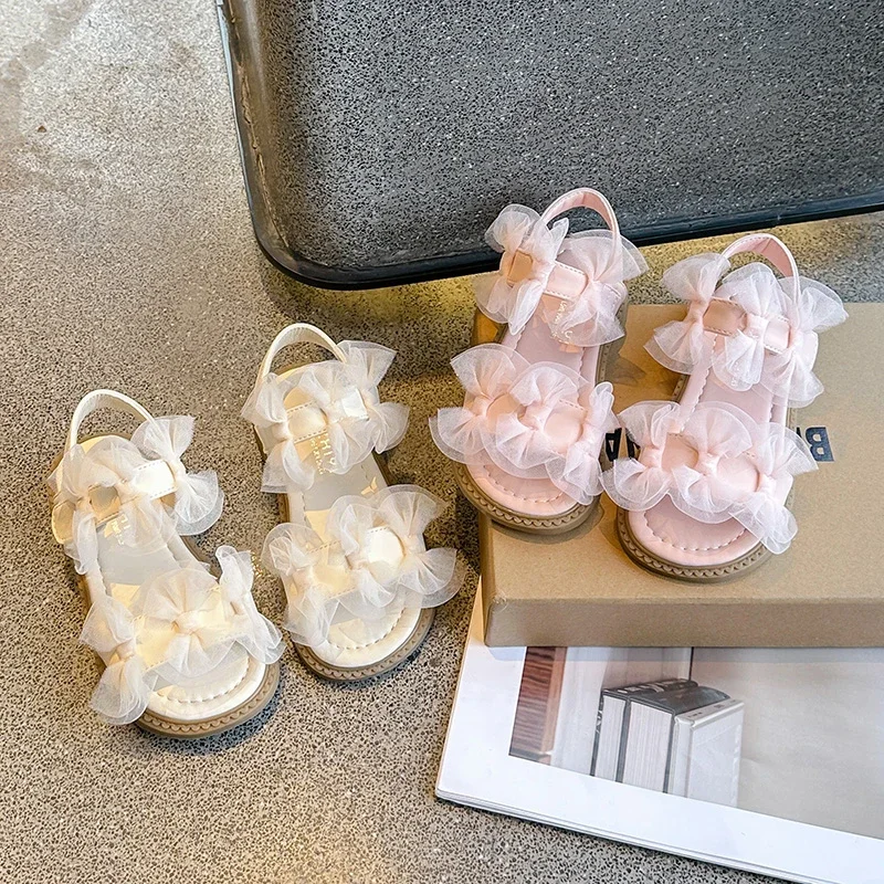 Sandalias de moda para niña, calzado de playa suave con lentejuelas de 26 a 36, zapatos de princesa con lazo, 2024