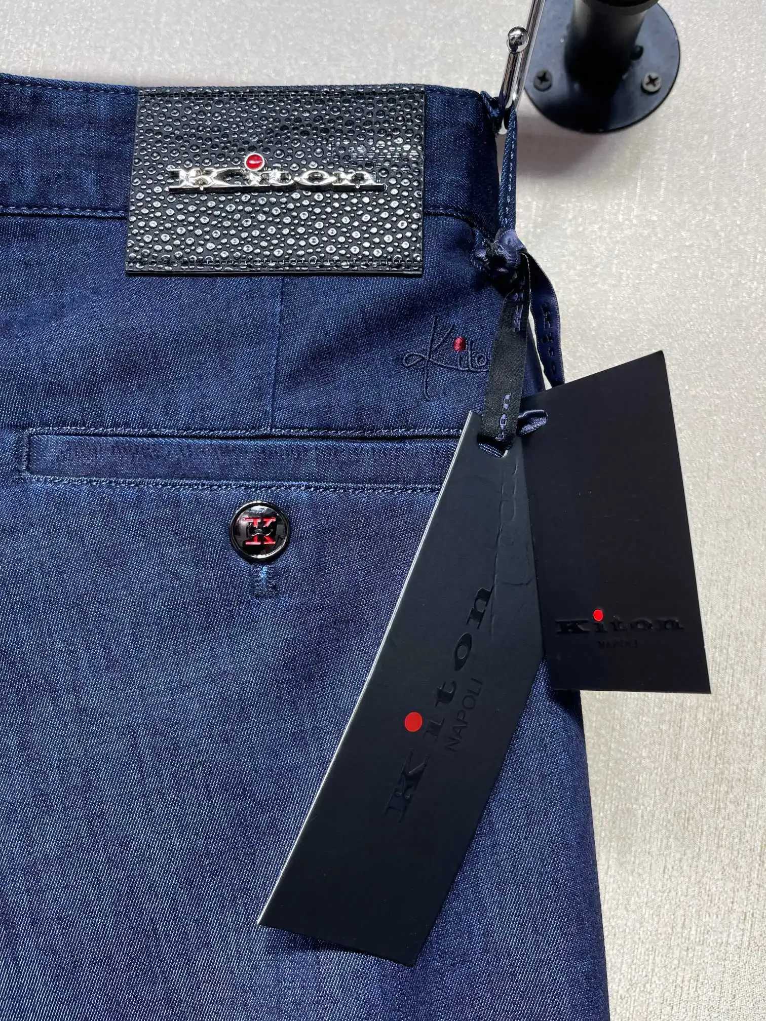 Kiton Spring/Summer 2026, classic primary color denim slanted pocket casual design, dark blue jeans