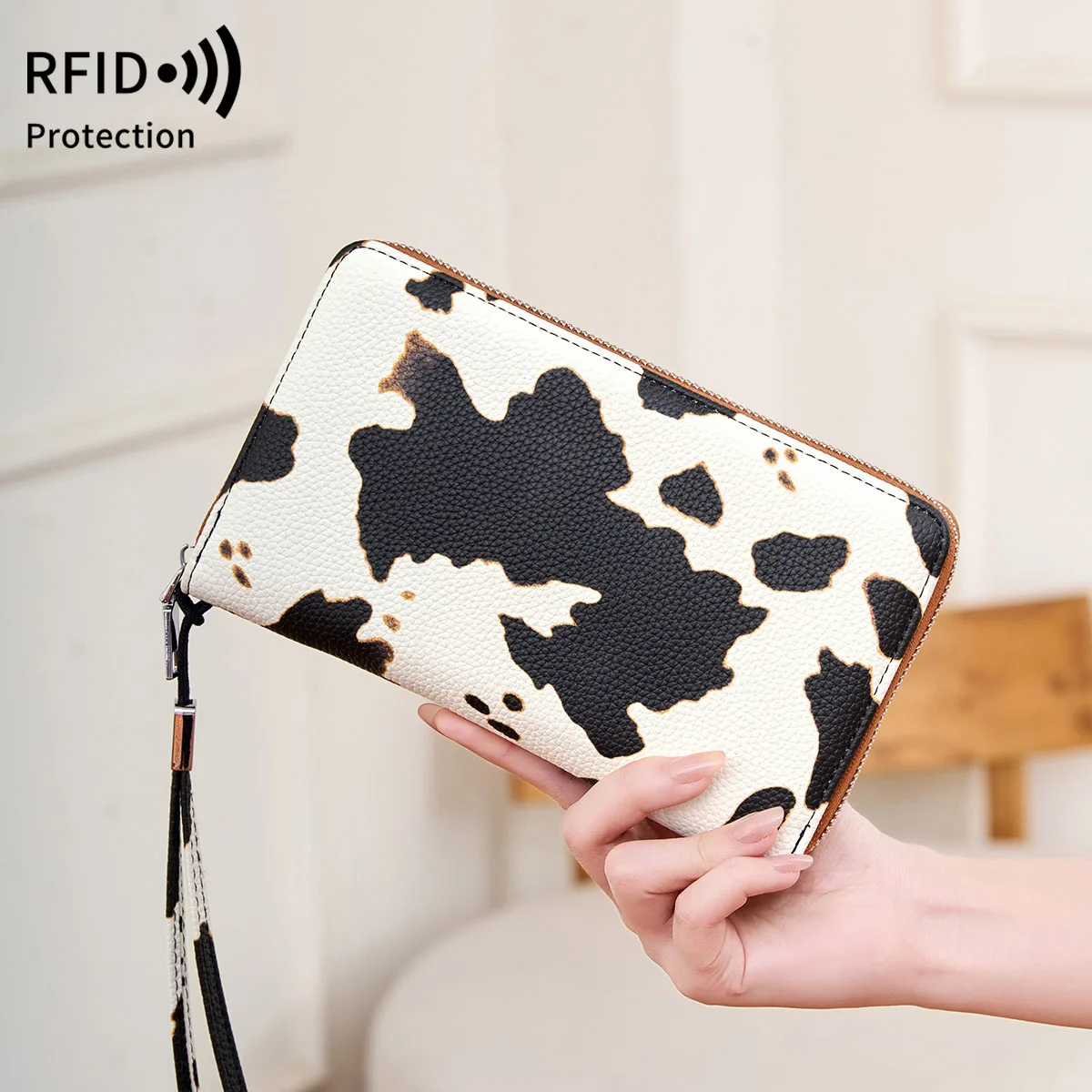 This RFID anti-theft swiping women's wallet features a large capacity, a lanyard, a hand-held multi-slot long wallet