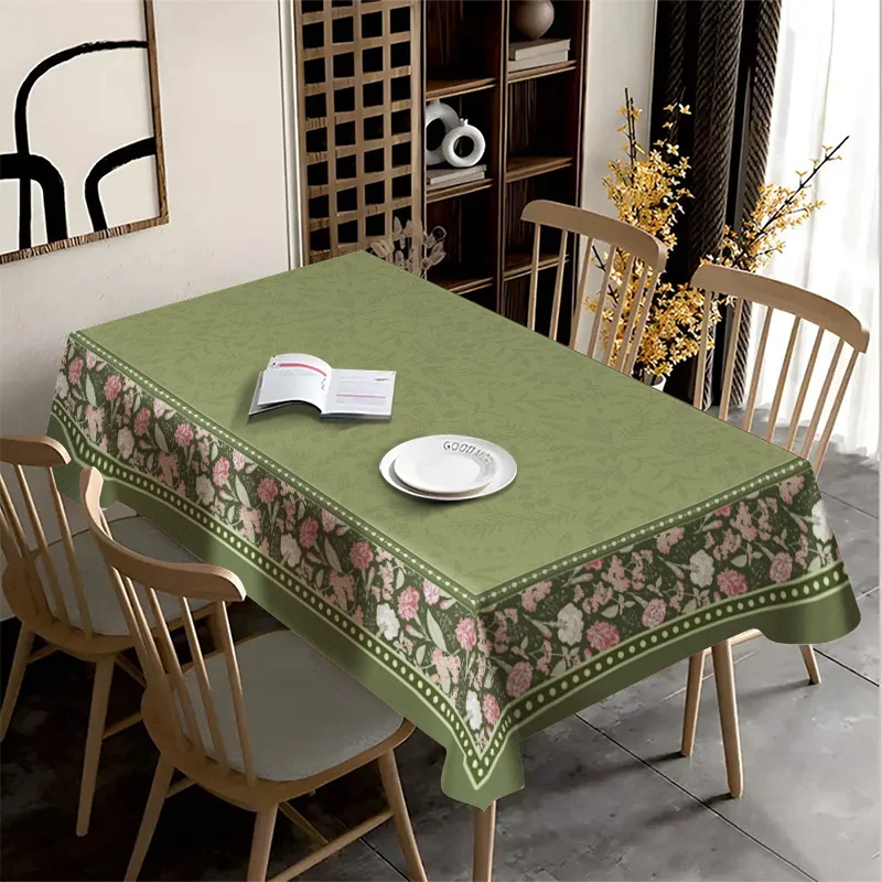 The tablecloth with a green background and pink flowers conveys a fresh and rural style.