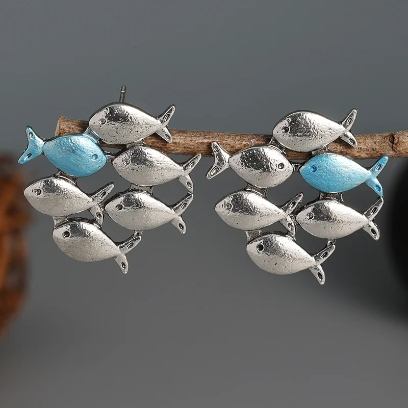 Swimming Against The Current Silver Color Stud Earrings. Mismatch. School of Fish with One Blue Swimming Upstream