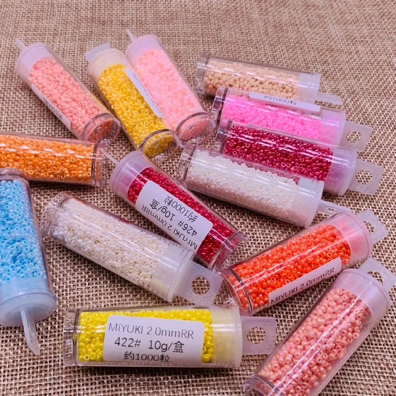 11/0 miyuki gyöngyök 2mm Magas légnyomású levegő Csillogtat Nehézfejű Futam Szóközbillentyű üvegek gyöngyök 1100pcs 28 színek számára DIY Nők garments Összevarrás kiegészítők