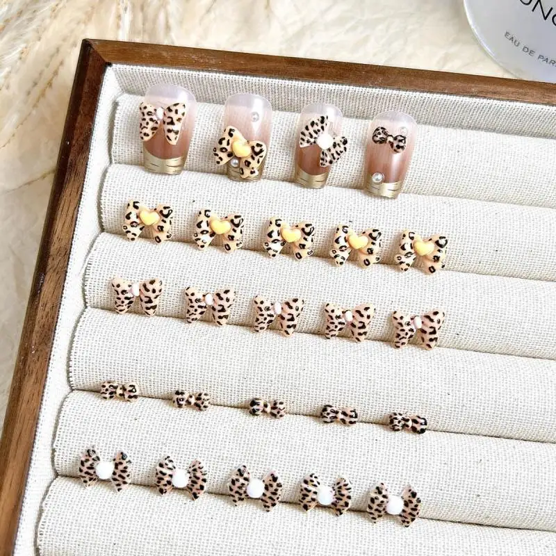 

Hot selling Brown Bowknots Nail Art Accessories 3D Maillard Color Leopard Spotted Tie Nail Charms for Making DIY Manicure Crafts