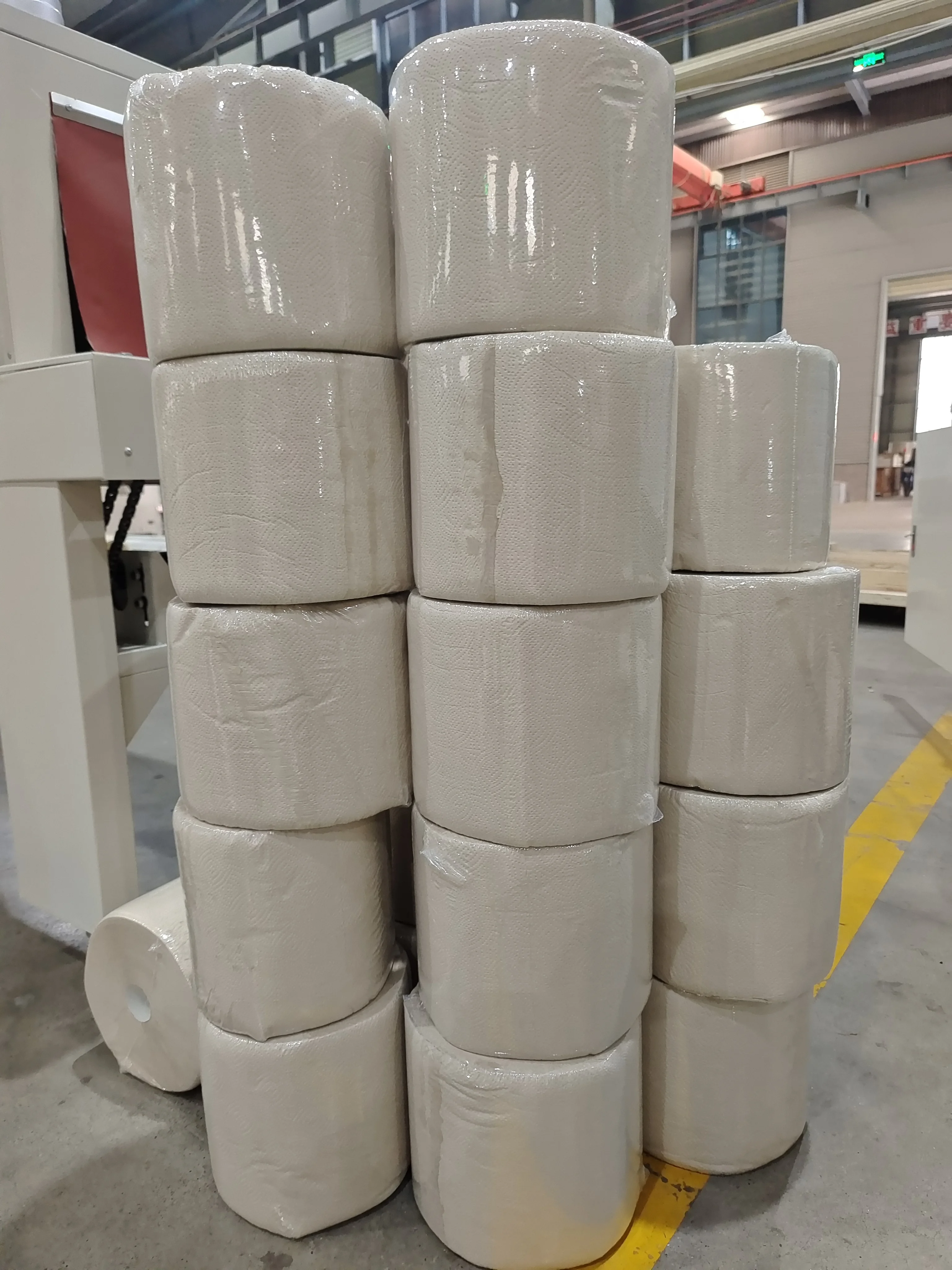 Automatic Toilet Paper Machinery with Simultaneous Trimming, Glue Spraying, Sealing and Shaft Extraction for Higher Efficiency