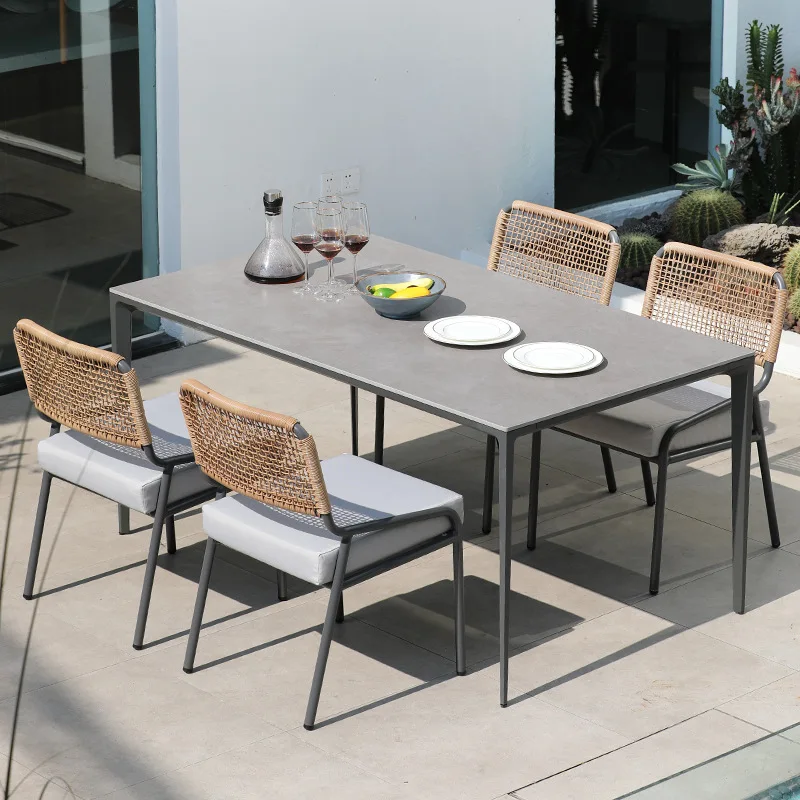 Garden rock slab dining table and chairs Outdoor courtyard rattan chairs Rattan chairs Homestay hotel