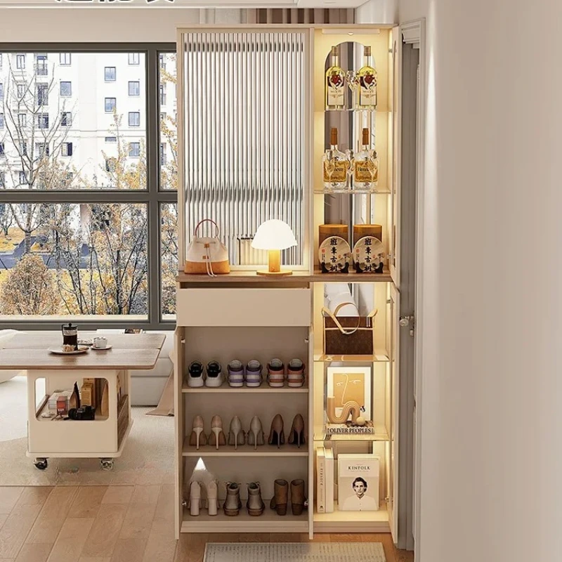 

cream wind is facing shoe cabinet at entrance door, screen partition is integrated into the living room