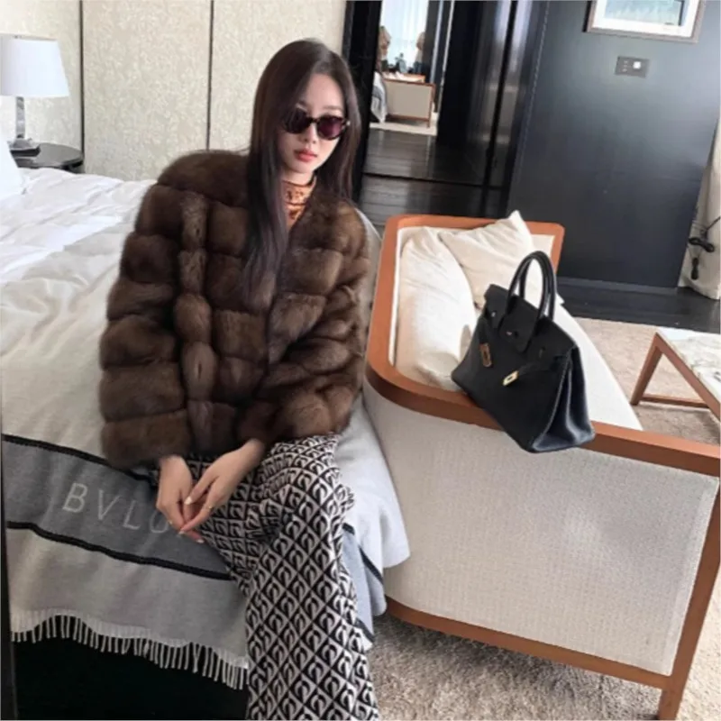 

Purple mixed fur coat with a women's collar