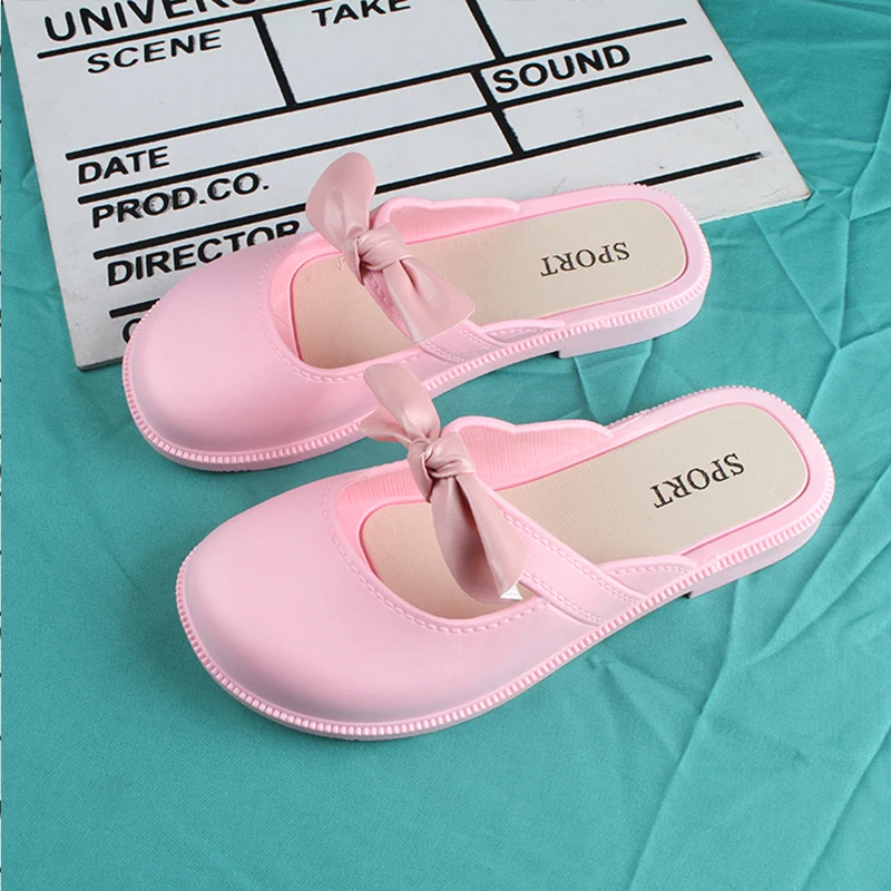 Children\'s New Summer PVC Little Girl Fashion Outside Wearing Solid Color Bow Half Drag Flat Sandals