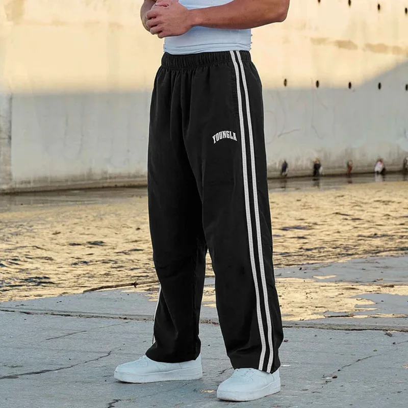 Pantalones de chándal para hombre, ropa informal de cintura media con estampado de tiras de empalme para gimnasio, deportes, Fitness, pierna ancha