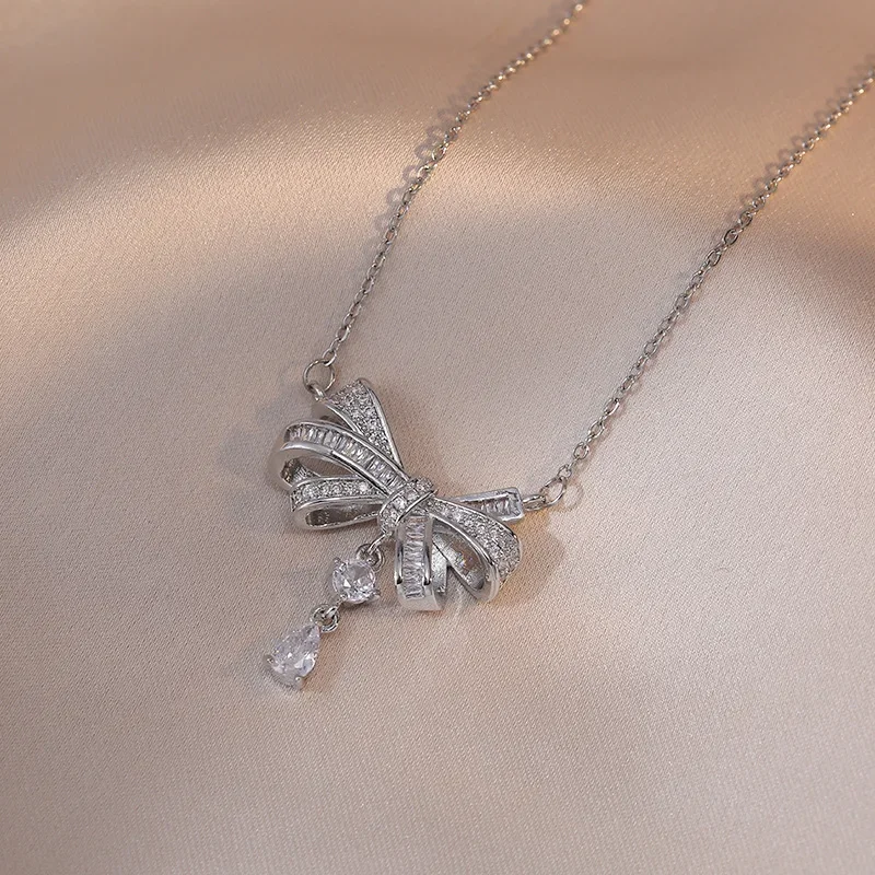 الكورية الأزياء رومانسية القوس قطرة قلادة الفولاذ المقاوم للصدأ المرأة حزب قلادة