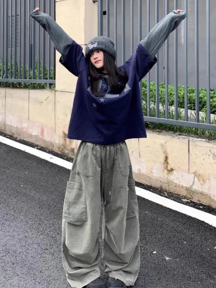 เสื้อยืดสไตล์อเมริกันย้อนยุค แขนยาว ทรงหลวม ช่วยพรางหุ่น แฟชั่นสำหรับผู้หญิง ดีไซน์ใหม่ ทันสมัย เหมาะสำหรับฤดูใบไม้ร่วงและฤดูหนาว สวมใส่สบายๆ