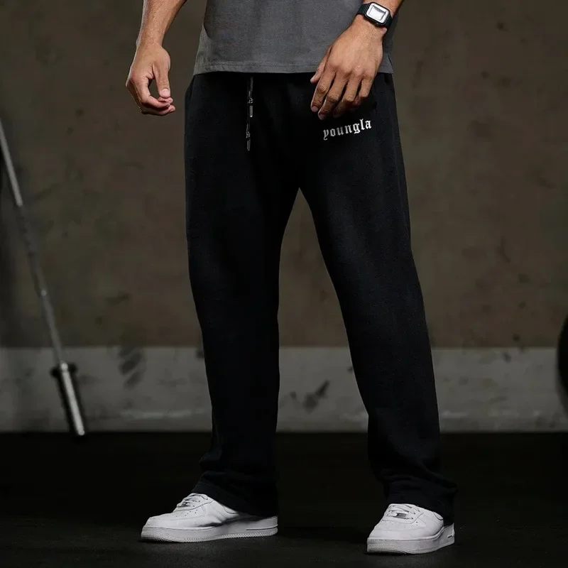 Men\'s sweatpants in autumn and winter new gym sports fitness cotton printed bouquets foot leisure pants.