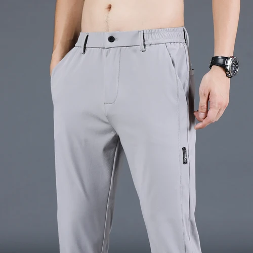Pantalones informales finos para hombre, ropa de seda helada, pantalones de pierna recta ajustadas coreanas a la moda, Primavera/Verano 2024
