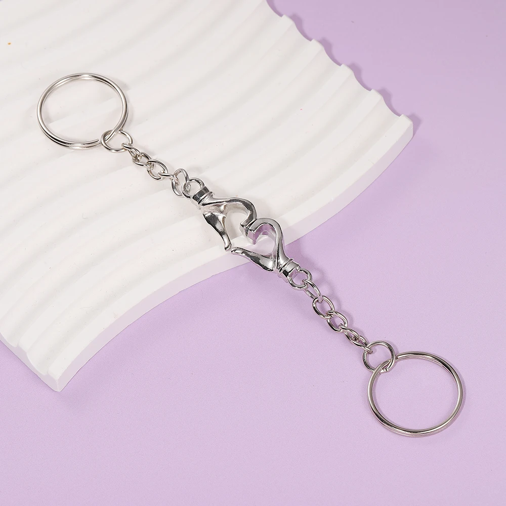 2 Stück Silberne Geometrische Magnetische Herz-Handschlüsselanhänger Paar-Trendige Vielseitige Personalisierte Punk Valentinstag-Geschenke