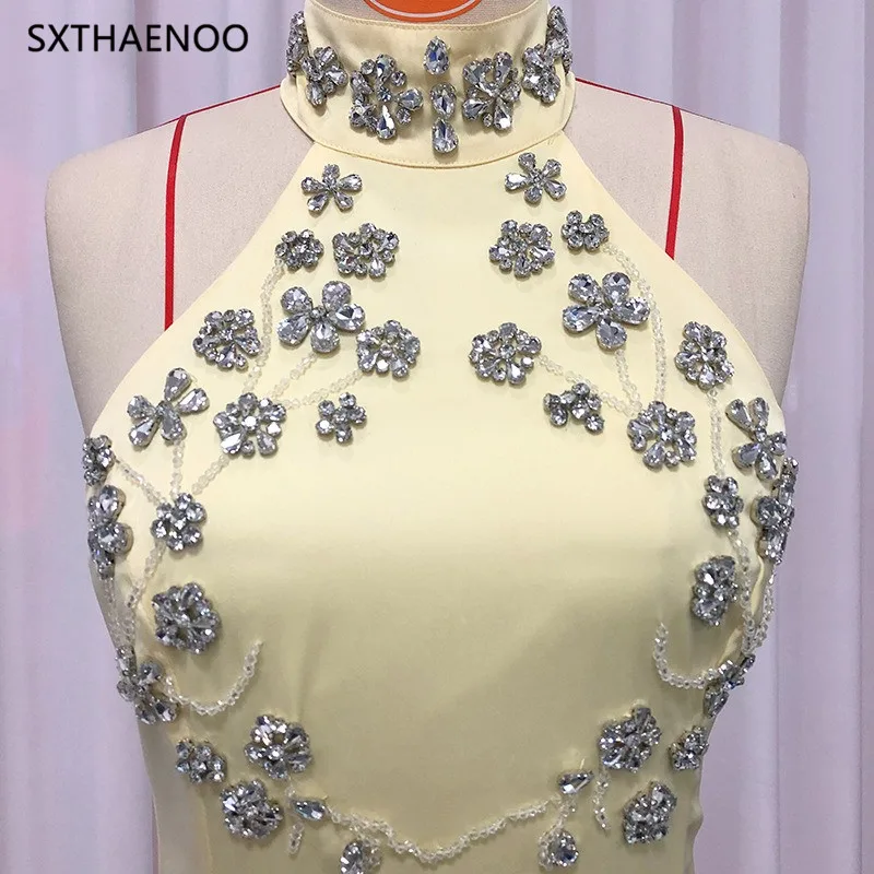 เดรสยาวหรูหราประดับลูกปัดทรงเข้ารูปสำหรับผู้หญิง สายคล้องคอ เปิดหลัง ทรงเสื้อคลุม ดีไซน์เรียบหรู รุ่นปี 2025