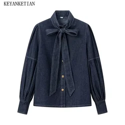 KEYANKETIAN 2024 New Launch Women's Bow Decoration Mock Neck Dark Blue Denim Shirt Elegant Vintage Lantern Sleeve Loose Blouse