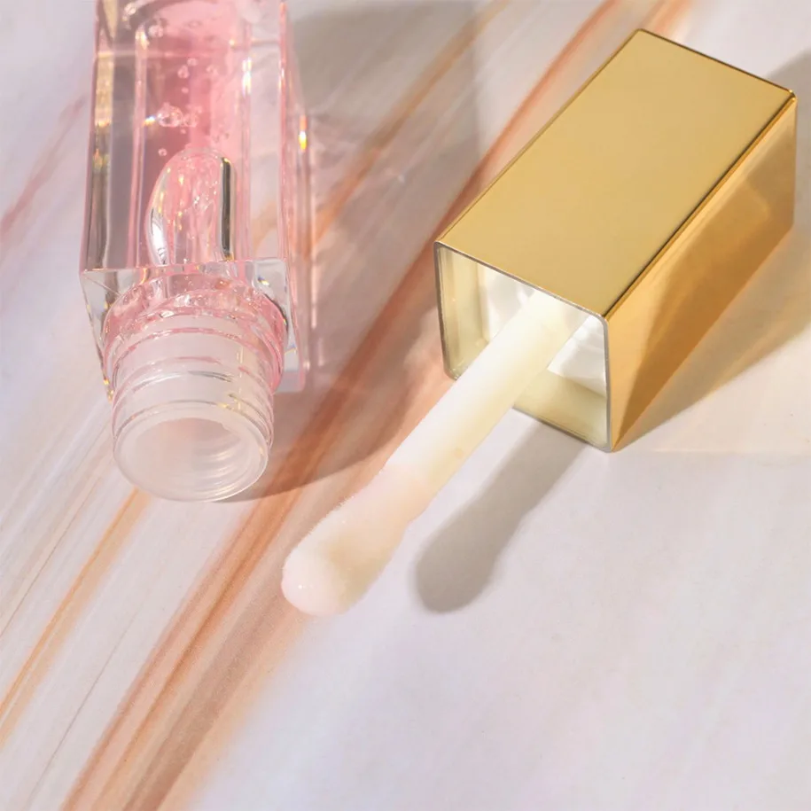 ฉลากส่วนตัวแต่งหน้ามังสวิรัติขายส่ง Lip Oil ช่วยลดความชุ่มชื้นแห้งลิปกลอส Plant Based Lip Care โลโก้ที่กําหนดเอง