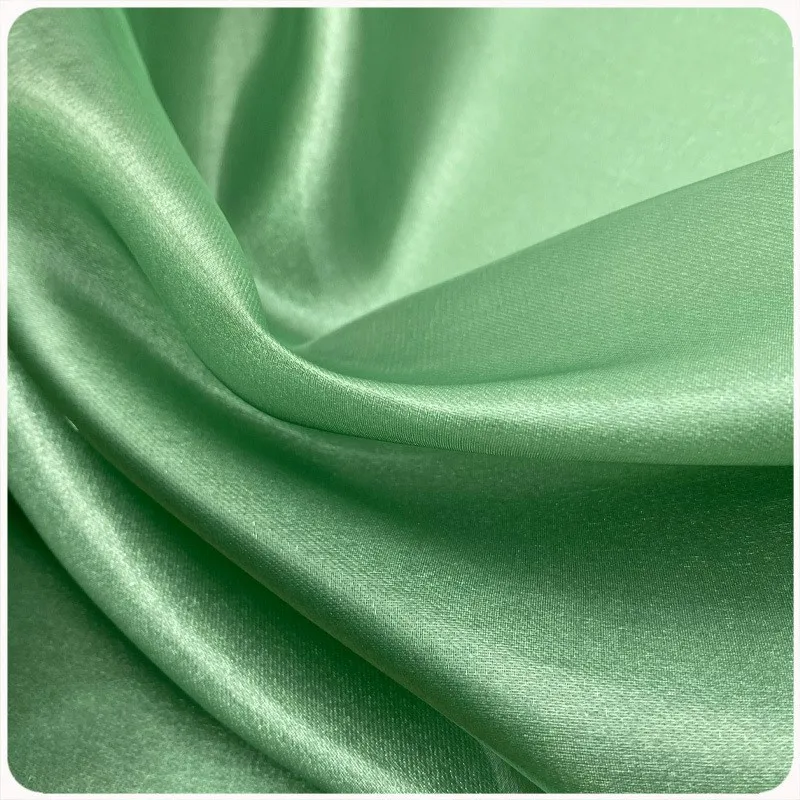 

The 98-gram organza fabric of glittering silk twill satin has light performance costumes dresses and fashion fabrics