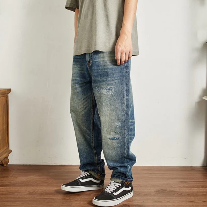 

Fake hole sticking fabric retro distressed jeans for young men, heavy weight straight tube loose denim pants, 2025 autumn