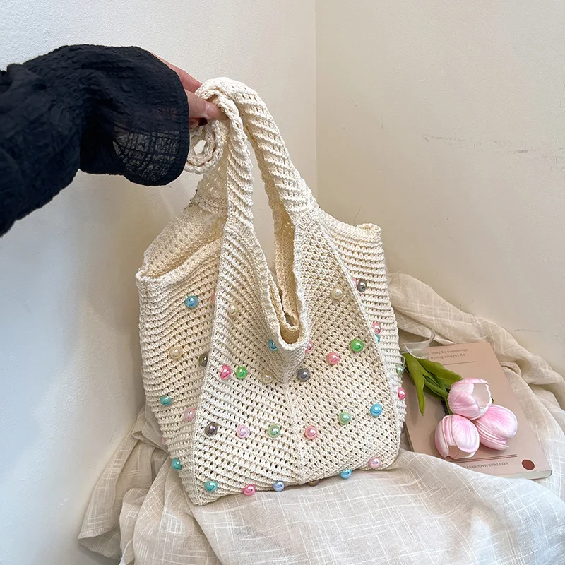 

Summer women's single-shoulder underarm bag, fashionable large-capacity handbag, beach pearl-shaped hollow shoulder bag