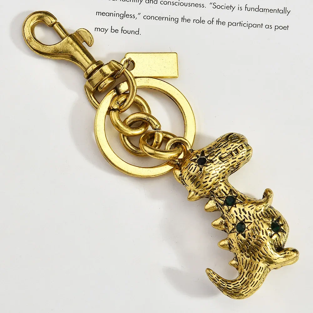 

2025 Three-dimensional dinosaur bag, keychain, metal car faucet, creative pendant, auto parts