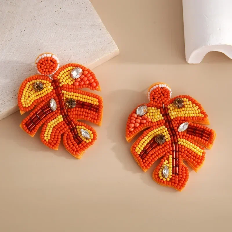 

Beaded earrings Leaf Graph Geometry Female Fabric art Hand knitting Bohemia Alloy Tide Simple Geometry Rice bead earrings
