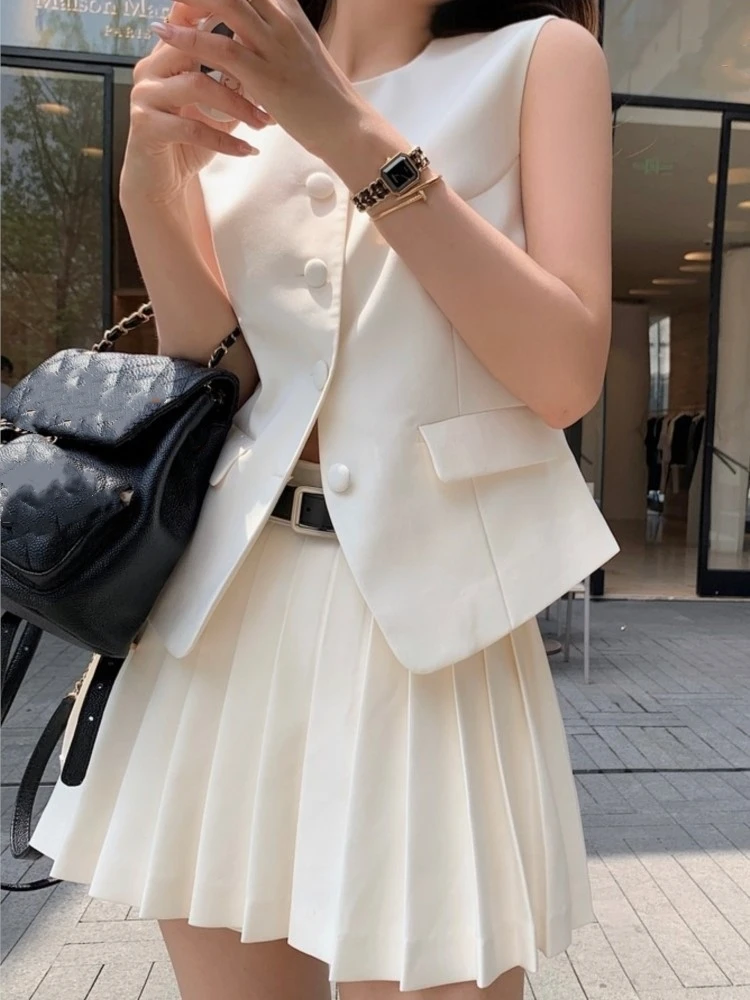 Falda plisada de moda coreana para mujer, conjunto de 2 piezas, Tops elegantes sin mangas con botones y pantalones de pierna ancha, trajes casuales