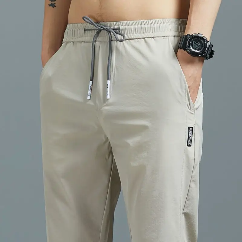 Pantaloni da tuta Casual di marca per uomo, pantaloni da jogging elasticizzati estivi da uomo pantaloni sportivi elastici per il Fitness da palestra all'aperto larghi e setosi