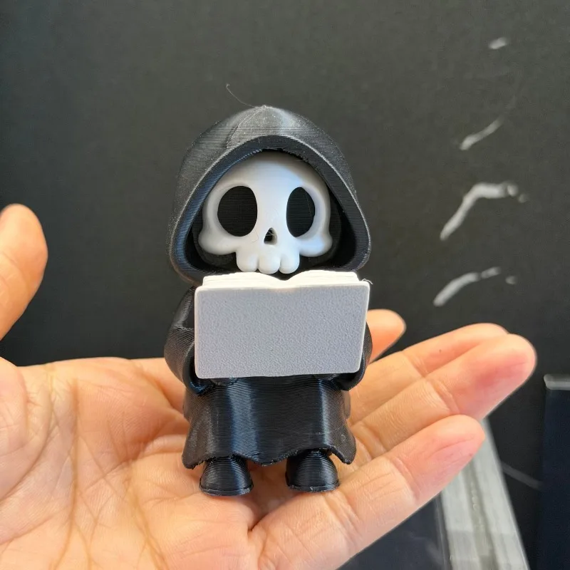 2pcs Collectible Figurine of a Cute Grim Reaper Reading Statues Sculptures, Gothic Literary Desktop Decoration for Halloween.