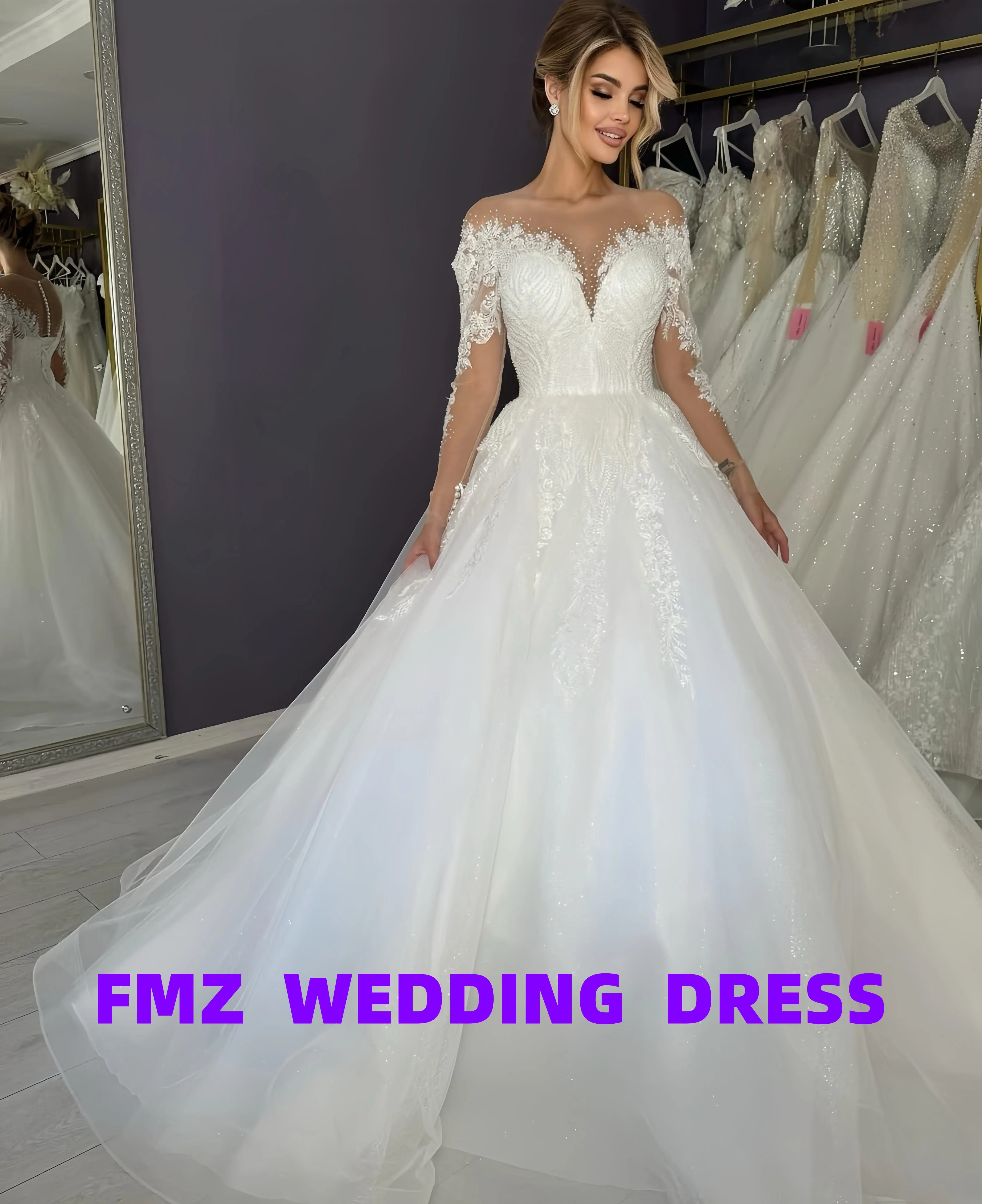 فستان زفاف أنيق بأكمام طويلة ورقبة على شكل حرف V مخصص من أماندا نوفيا فيستدوس دي نوفيا أماندا