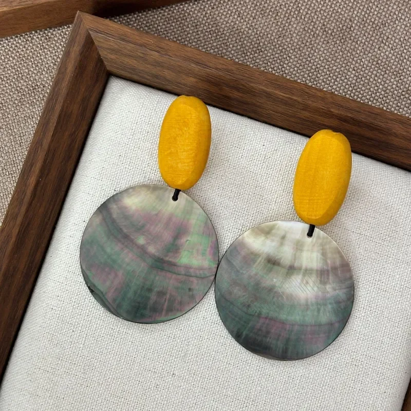 Retro contrasting color yellow wood beads black butterfly shell large round piece earrings literary niche natural shell