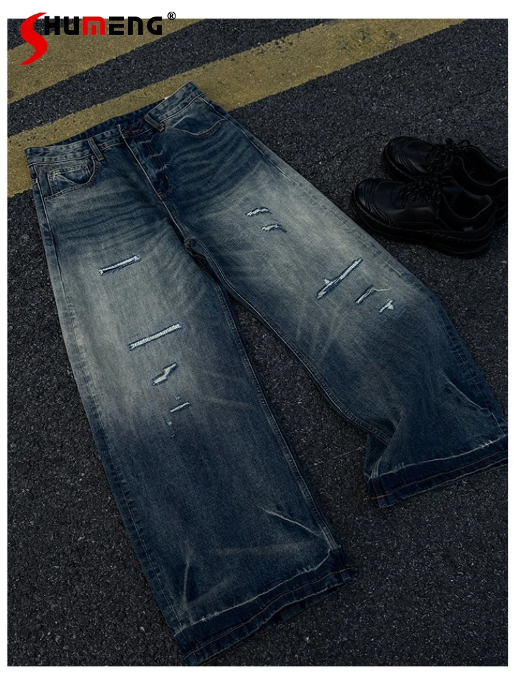 

Fashion Hole Jeans Men's 2026 Spring New Trendy Pocket Decoration Zipper Denim Pants Chic Loose Wide Leg Curved Denim Trousers