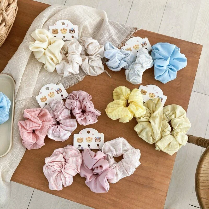conjunto-de-tres-pecas-de-acessorios-de-cabelo-femininos-estilo-coreano-com-elasticos-volumosos-florais-rosa-para-coque-medio