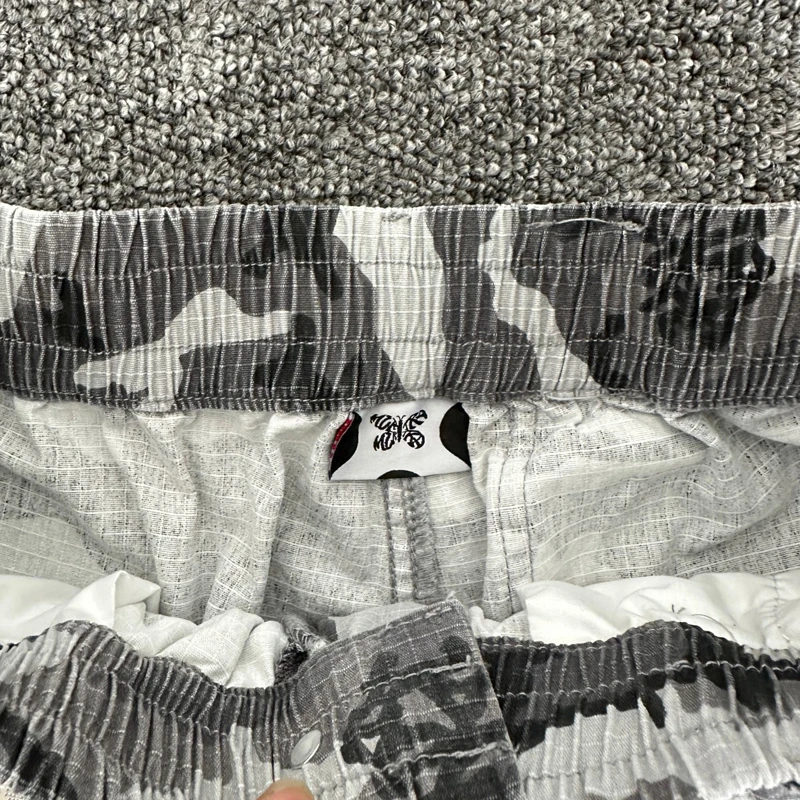 Foto Real High Street mono clásico con estampado de camuflaje pantalones cortos Mertra ropa de calle americana pantalones de chándal informales sueltos para hombres