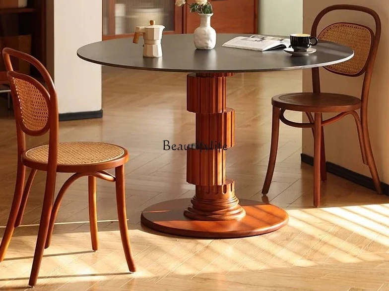 

Nordic retro solid wood home round table designer light luxury Roman column rock slab table