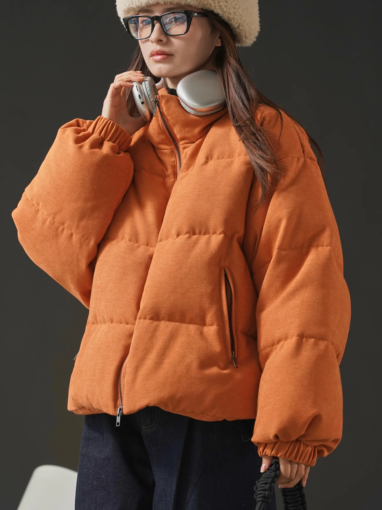 Winter women\'s casual solid color stand up collar long sleeved loose down jacket