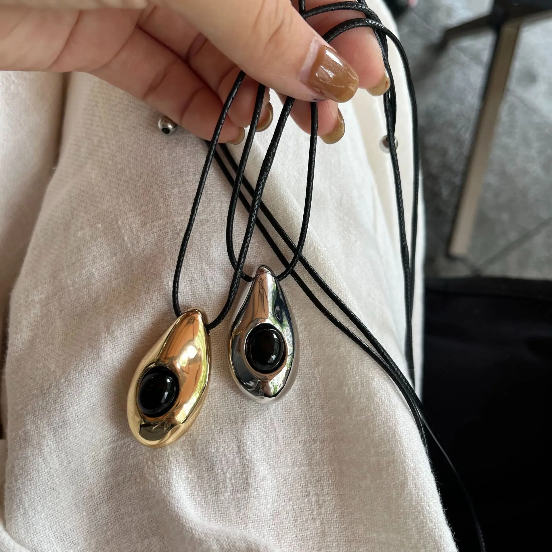 

HUANZHI European and American Irregular Metal Water Drop Pendant Black Rope Pulling Necklace for Women Girls Holiday Jewelry