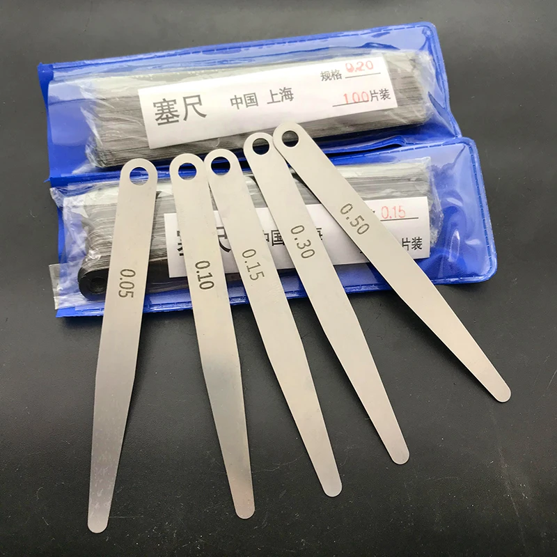

0,02 мм 0,03 мм 0,04 мм 0,05 мм 0,06 мм 0,07 мм 0,1 мм 0,15 мм 100 шт. щуп цельный инструмент для измерения зазора прокладки
