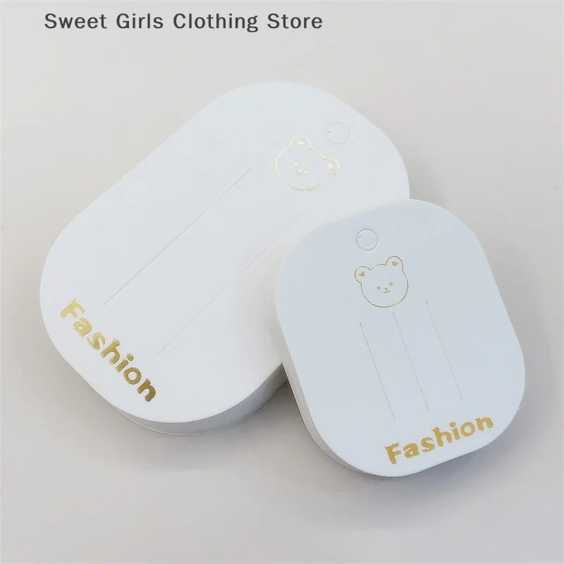 Karta ekspozycyjna akcesoriów do włosów do projektów DIY - zestaw 50 spinek do włosów z motywem małego misia.