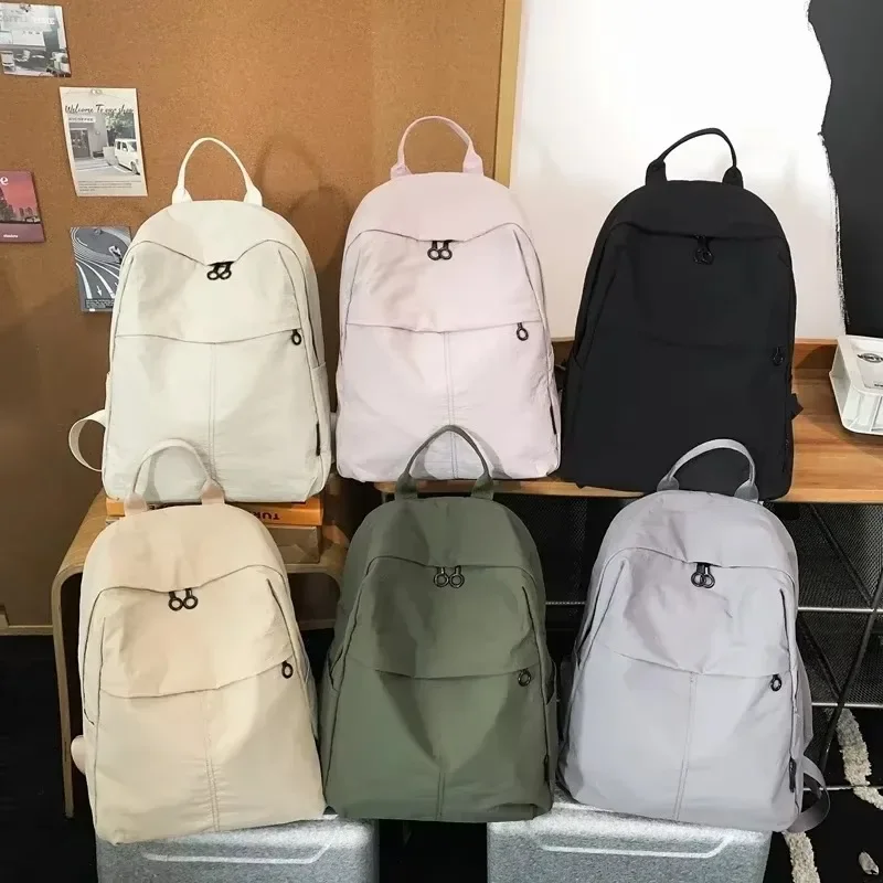 Sacs à dos en nylon solide à fermeture éclair pour femmes, sacs grande capacité, sacs d'école, décontracté, haute qualité, 2025, en vente