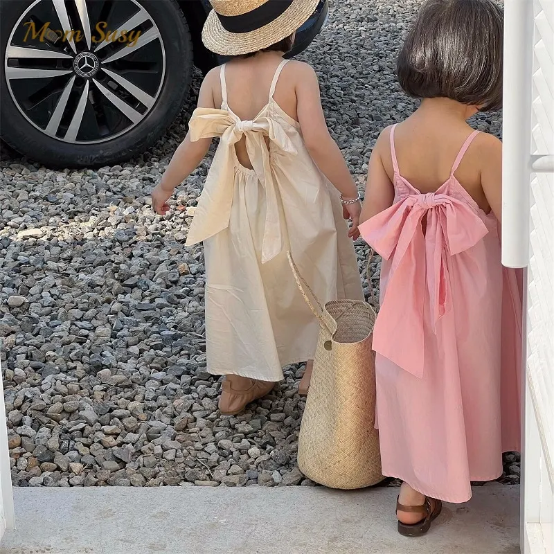 Moda dziewczynka księżniczka bawełniana sukienka na ramiączkach z kokardką niemowlę maluch dziecko szelki Vestido jednokolorowe letnie ubranka dla dzieci 1-10Y