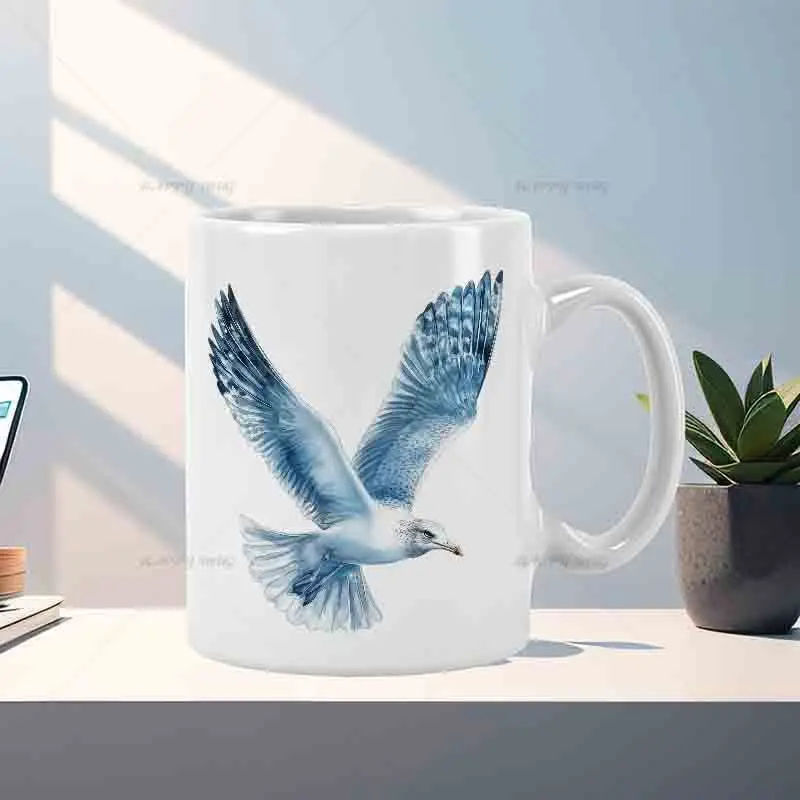 This mug features a soaring seagull design and is machine washable, making it suitable for use in the kitchen and office.