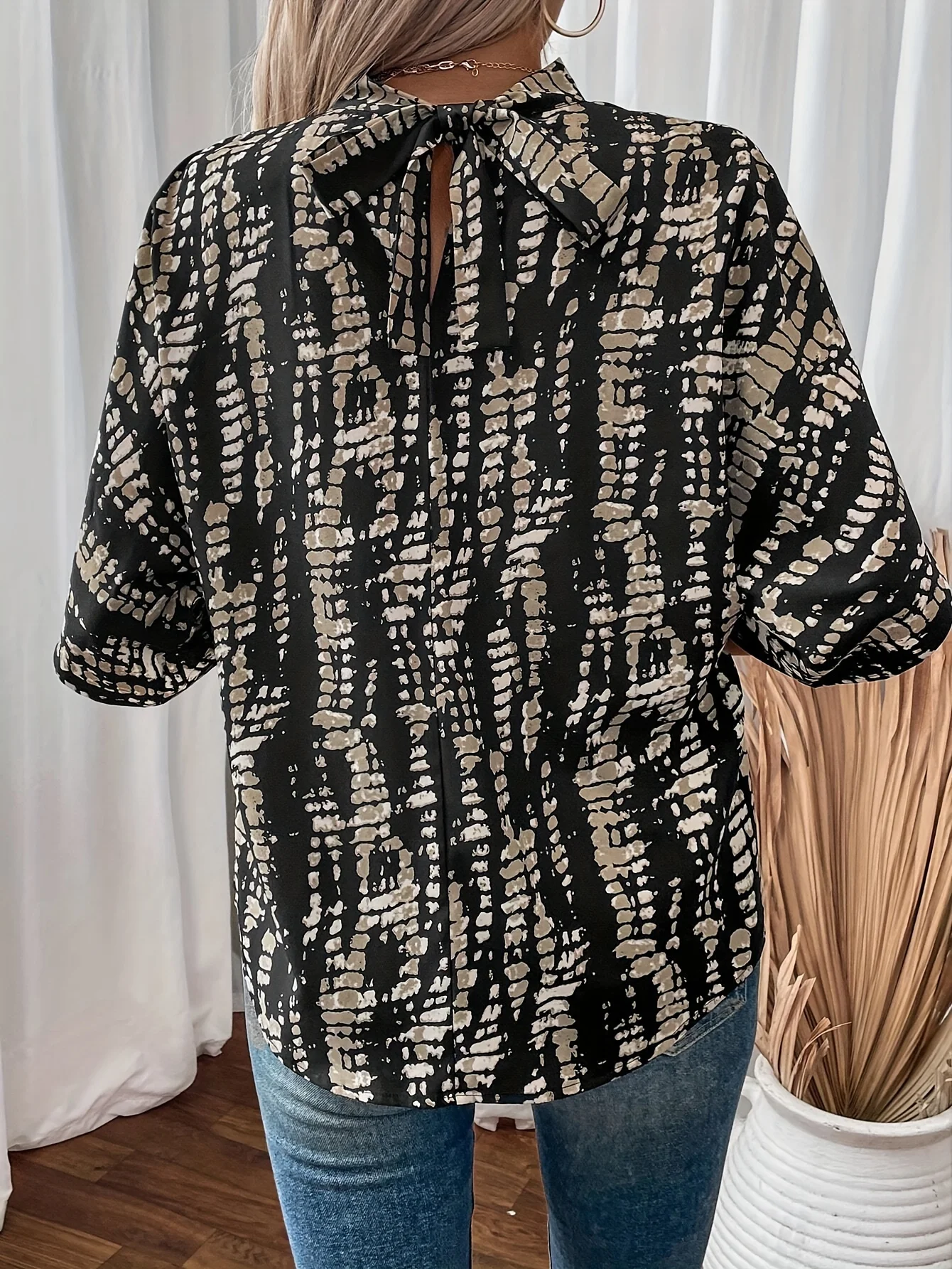 New black base top with printed stand up collar, tie bow, asymmetrical loose bat sleeve top T-shirt