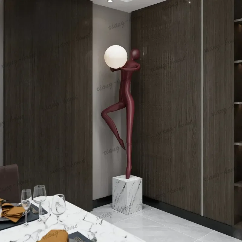 Modern welcoming abstract figure holding a lamp, sculpture ornament, creative floor lamp for living room and bedroom