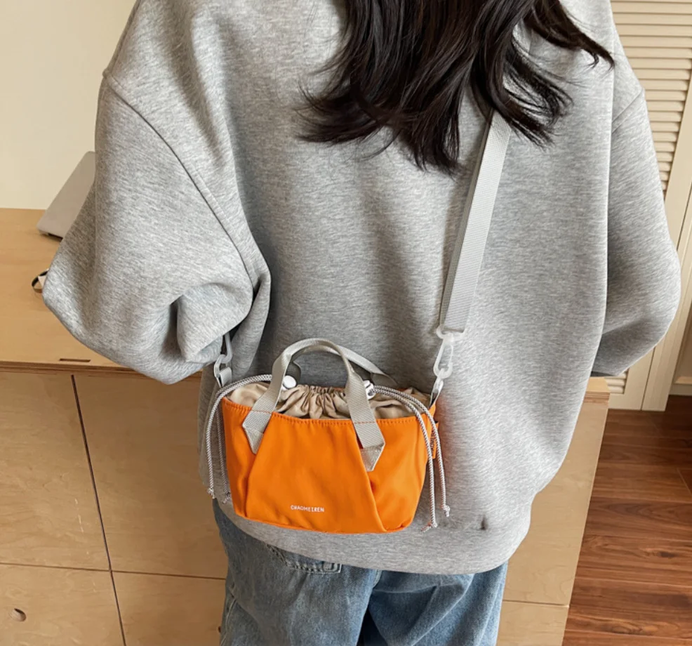 

Casual Solid Color Exquisite Stylish Design Nylon Drawstring Shoulder Bags 2026 New Fresh Youth Crossbody bags for Women bolsos